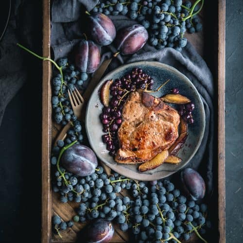 Perfect Brined Bone In Pork Chop with Roasted Grapes and Plums by Eva Kosmas Flores