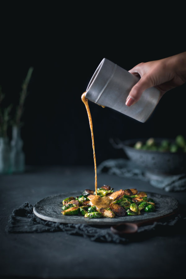 Crispy Brussels Sprouts with Mustard Vinaigrette Pouring